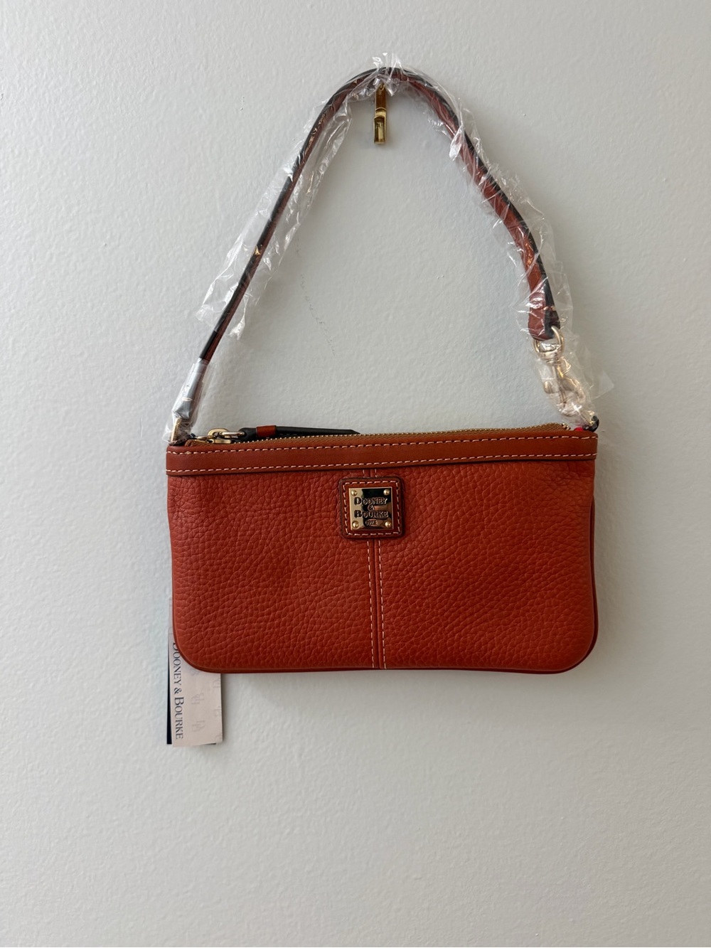 Dooney & Bourke Burnt Orange Pebbled Leather Wristlet